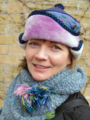 A close up of a woman wearing her new light pink and blue Anoushka HatA close up of a woman wearing her new light pink and blue Anoushka Hat