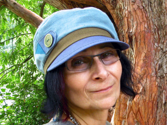 A client wearing her new light blue linen cap